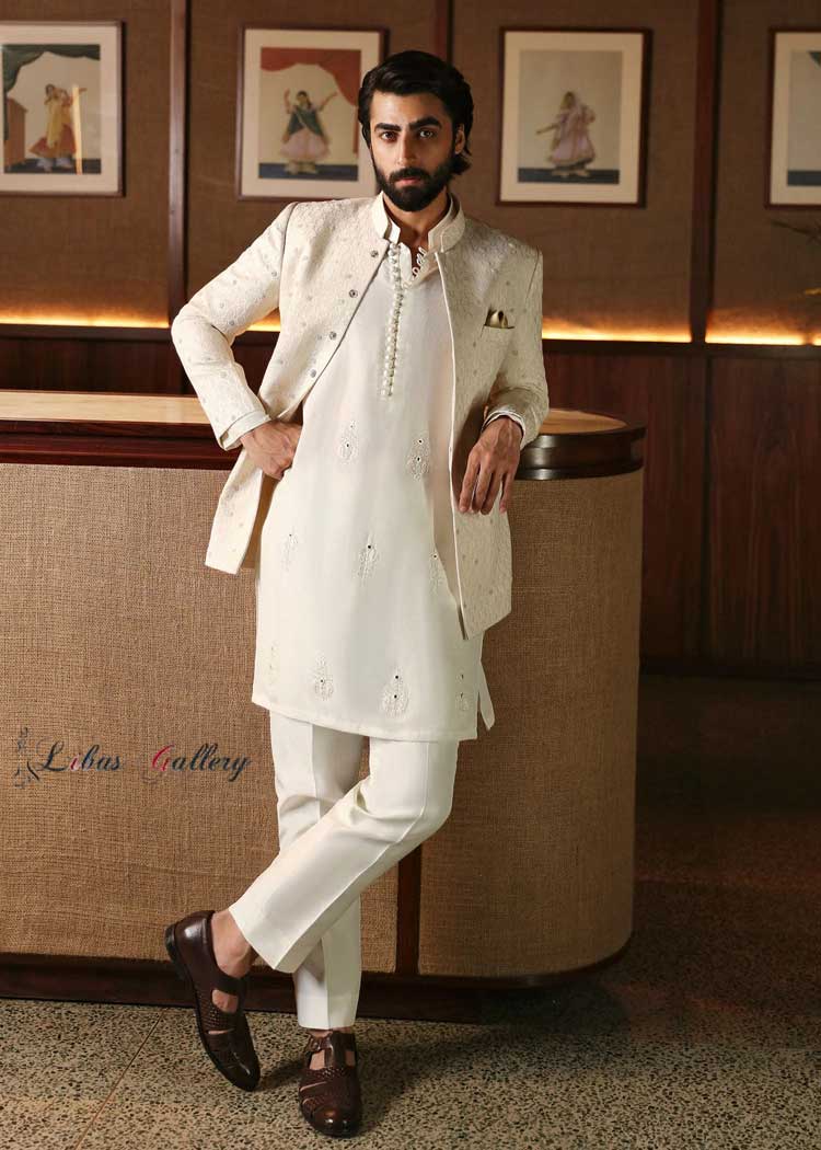 Nameer Khan in Off white Karandi based Prince coat embellished from finest Quality Pearl work Paired with Dori and mirror worked kurta Florida Georgia Hawaii USA Nameer Khan in Off white Karandi based Prince coat embellished from finest Quality Pearl work Paired with Dori and mirror worked kurta Florida Georgia Hawaii USA