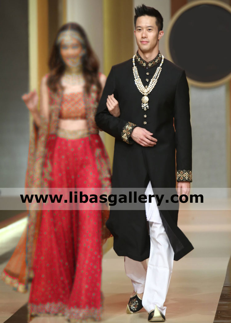 Black Sherwani Groom wearing with pearls mala brooch 