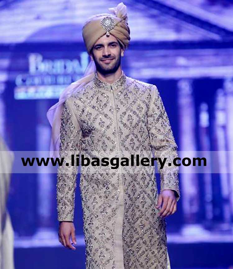 gold turban pretied for barat day groom showing humble smile