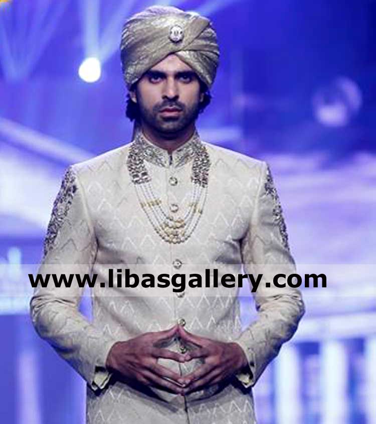 Groom in pakistani turban making sign of bond with his bride